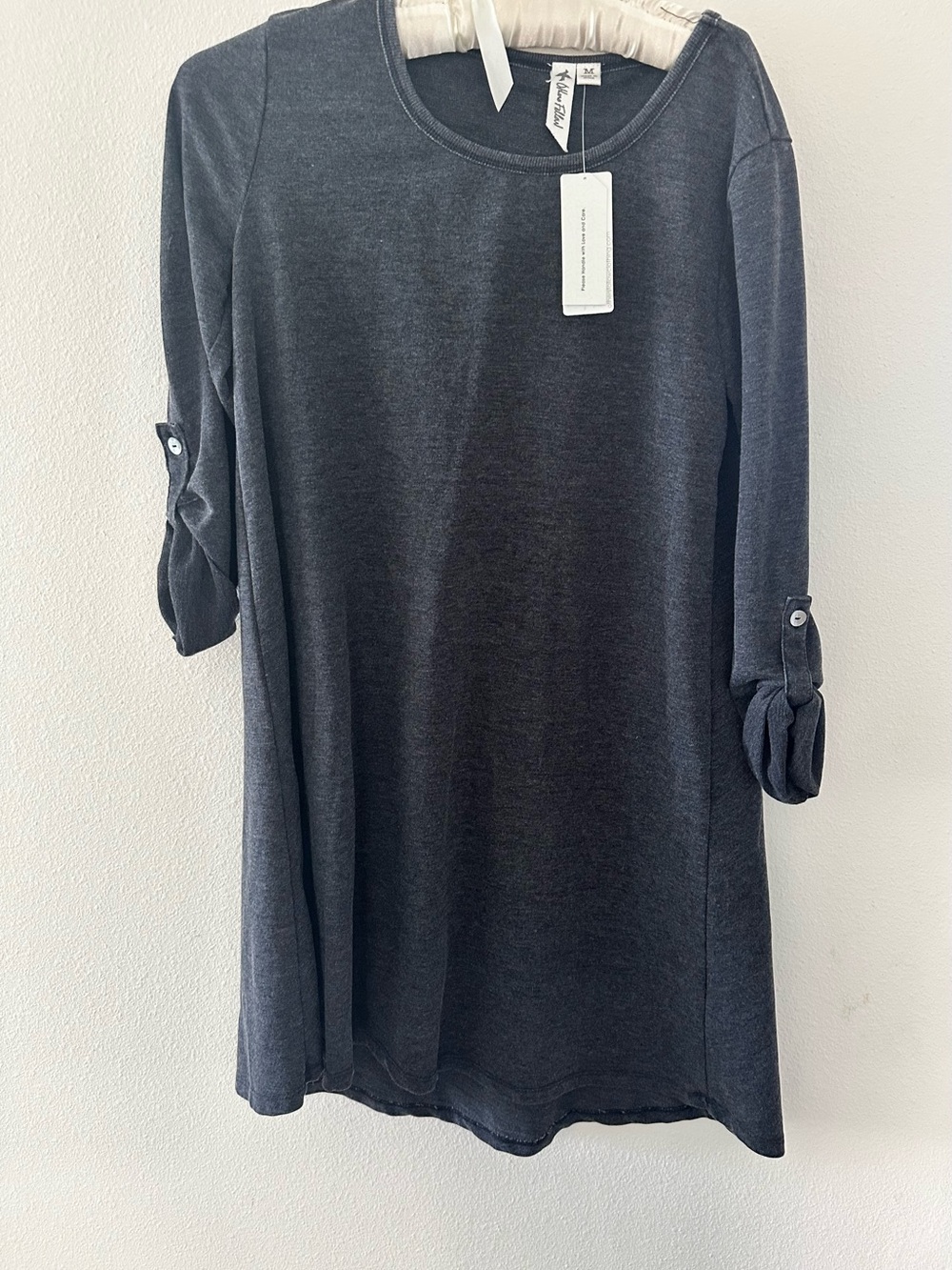 Charcoal knit dress. New with tags. Roll up sleeves.